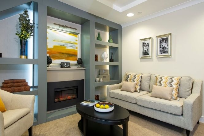 Comfortable resident lounge at Nesbit House Care Home in Orpington with soft seating, fireplace and relaxing communal spaces for daily life