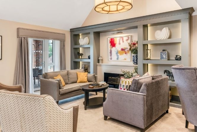 hindhead place in hindehad, surrey interior lounge. sofas with fire place.