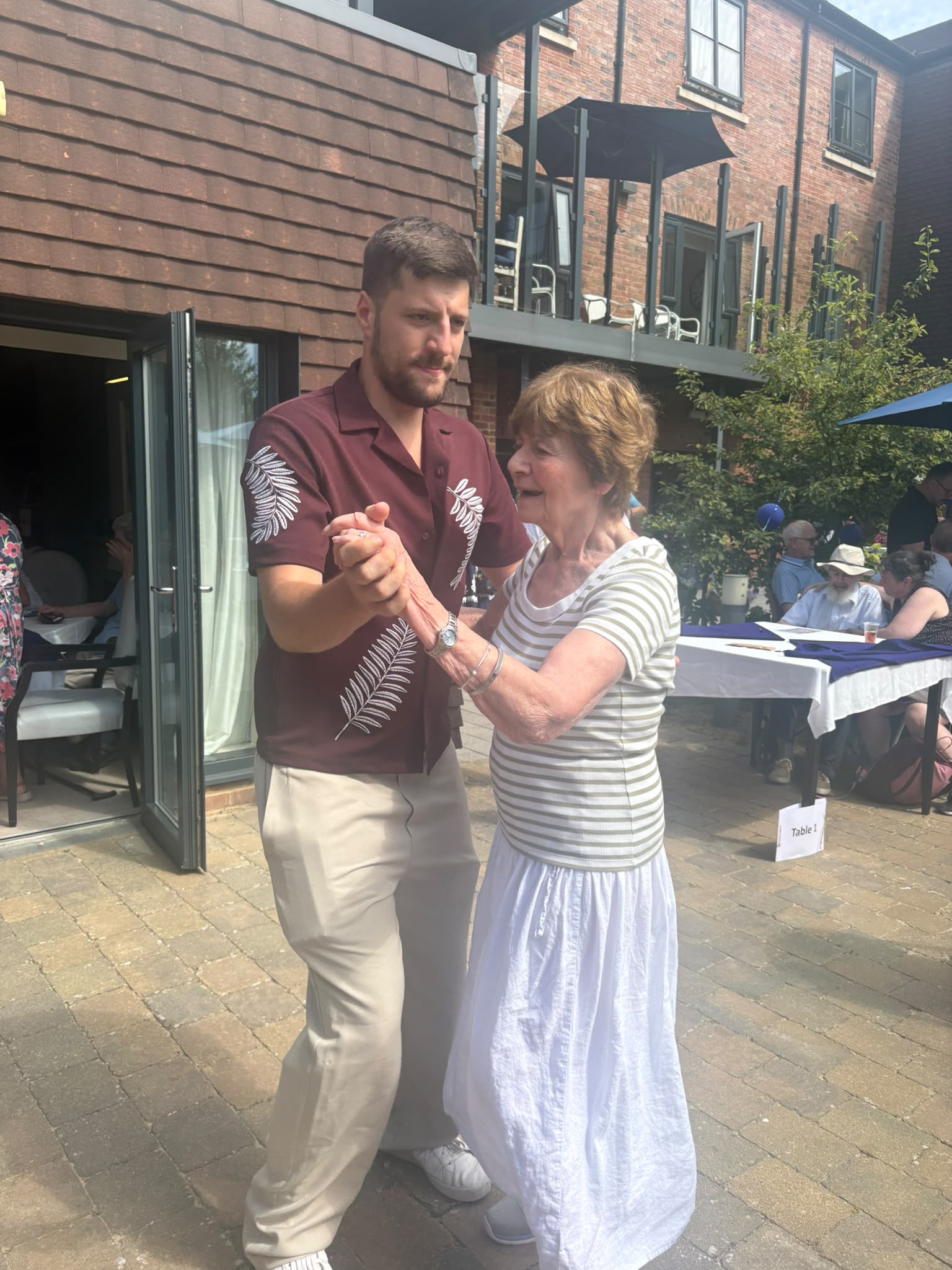 Nesbit house resident dances with visitor