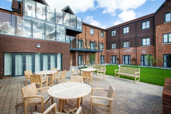 Secure landscaped courtyard garden at Nesbit House Care Home in Orpington with outdoor seating for residents, visitors and social activities