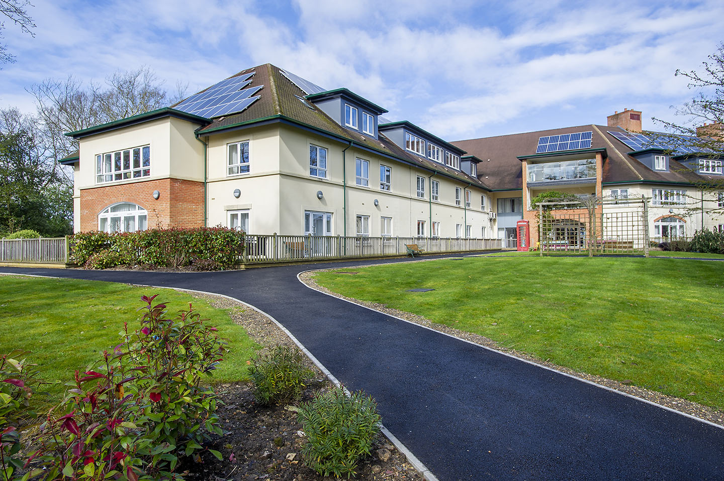 Private balcony at Upton Manor Care Home in Poole, overlooking landscaped gardens and surrounding trees
