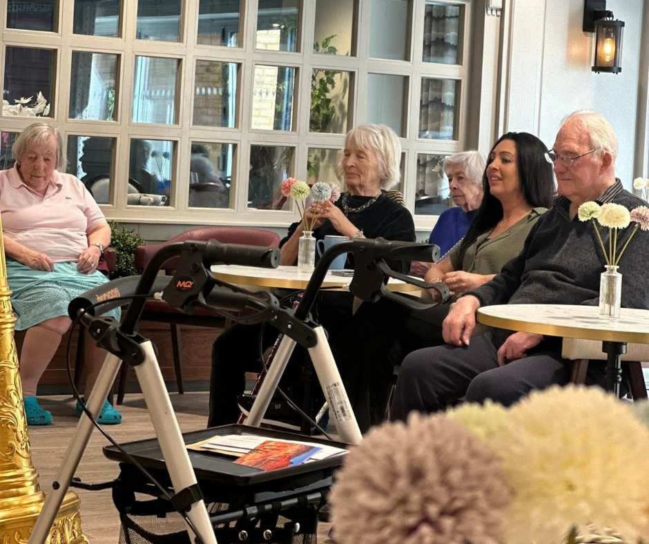 residents in dining area listening to harp player at Dorking Manor