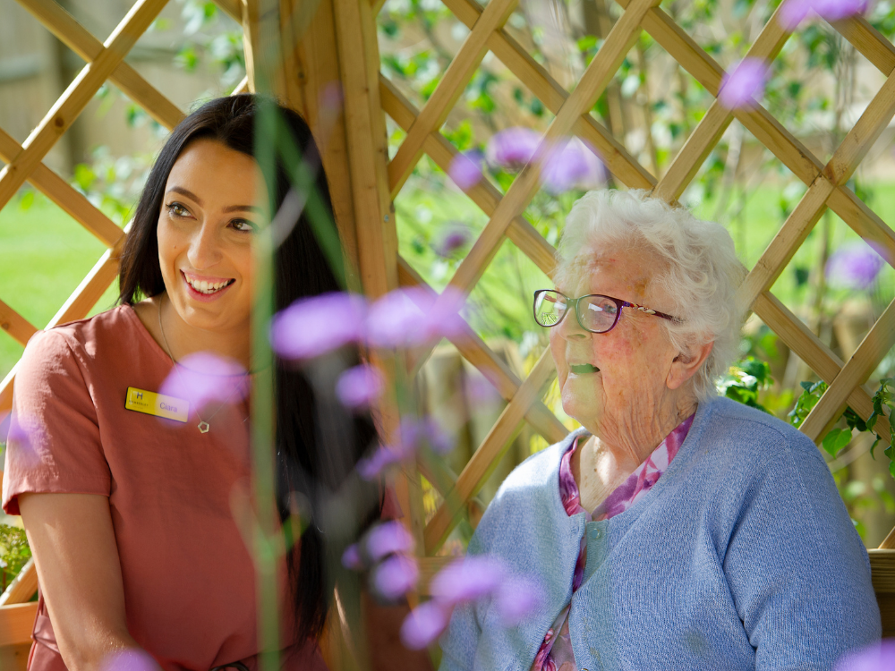 resident and homemaker sat in garden