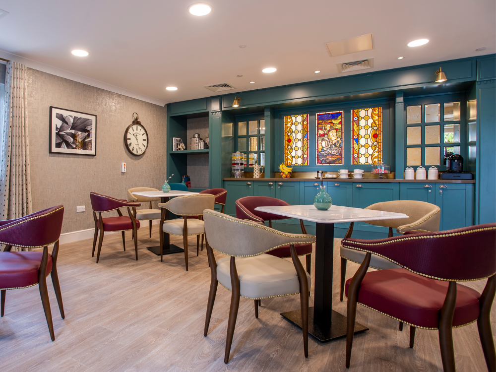richmond manor care home in ampthill, cafe area with stain glass effect windows