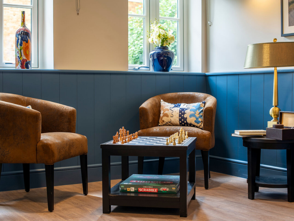 seathign with table and chess board and scrabble set - games area for residents