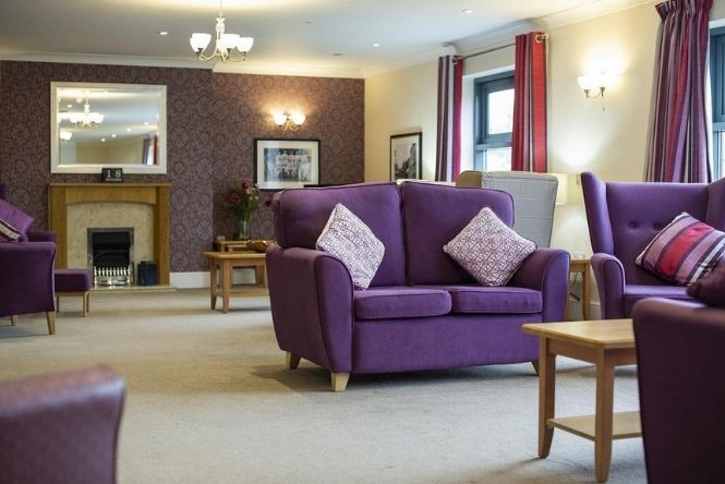 Lounge with purple seat fabric - sofas and coffee tables