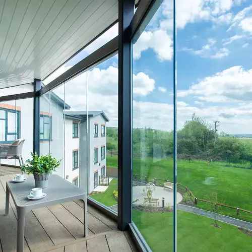 balcony view of gardens at Chawley Grove dementia care home in Oxford