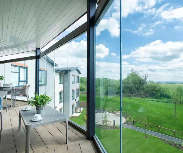 balcony view of gardens at Chawley Grove dementia care home in Oxford