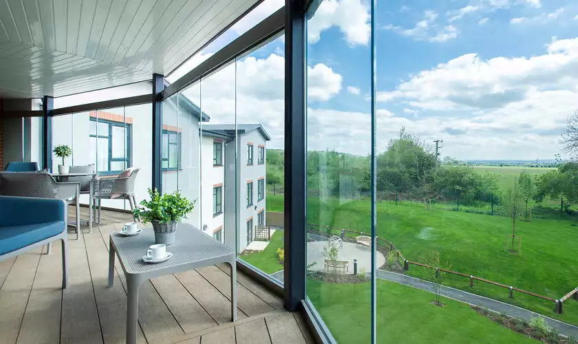 balcony view of gardens at Chawley Grove dementia care home in Oxford
